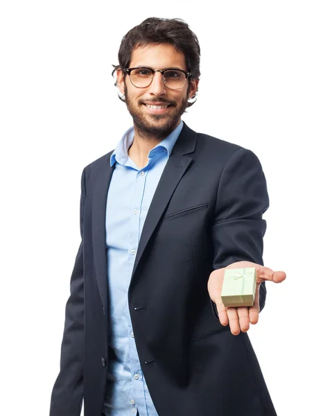 Happy businessman with gift — Stock Photo, Image