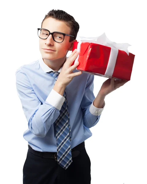 Happy businessman with gift — Stock Photo, Image