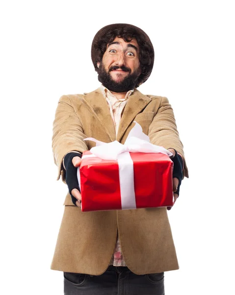 Happy young man with gift — Stock Photo, Image