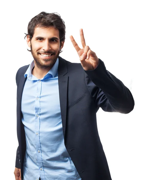 Happy businessman with victory sign — Stock Photo, Image