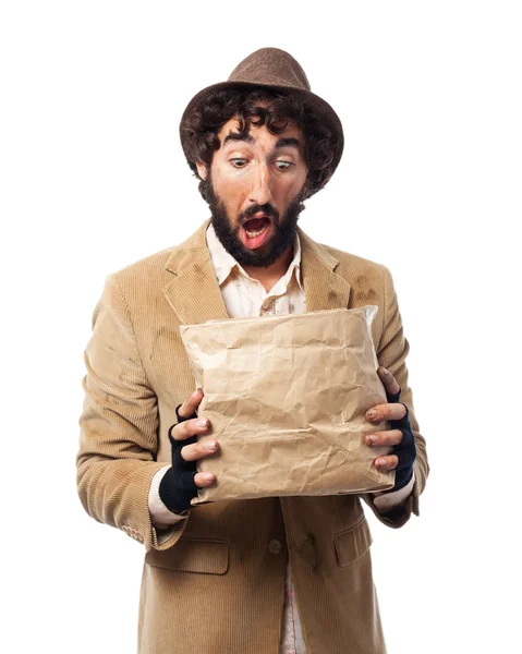 Surprised homeless man with paper bag — Stock Photo, Image