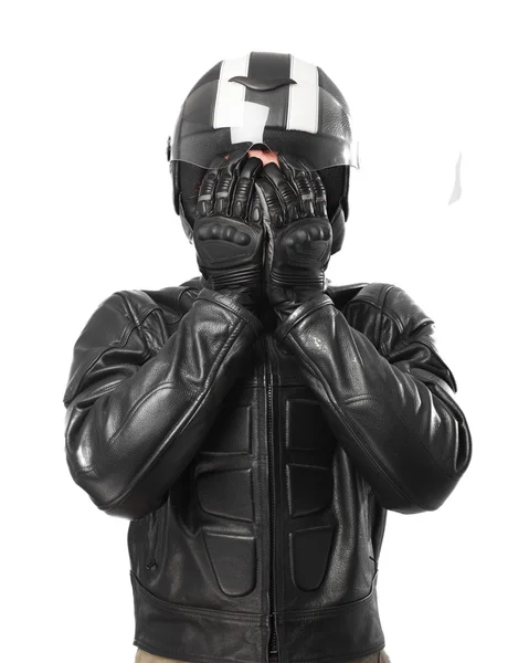 Scared biker covering face — Stock Photo, Image