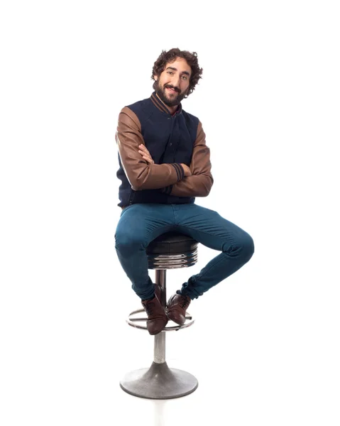 Happy young man with bar stool — Stock Photo, Image