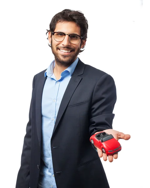 Happy businessman with red car — Stock Photo, Image