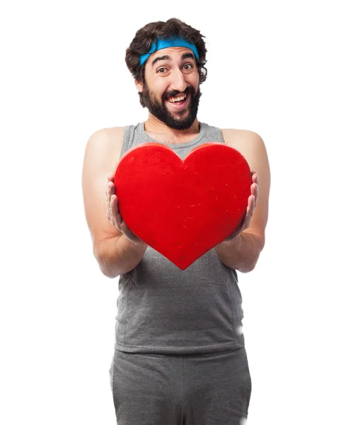 Homme heureux de sport avec symbole de coeur — Photo