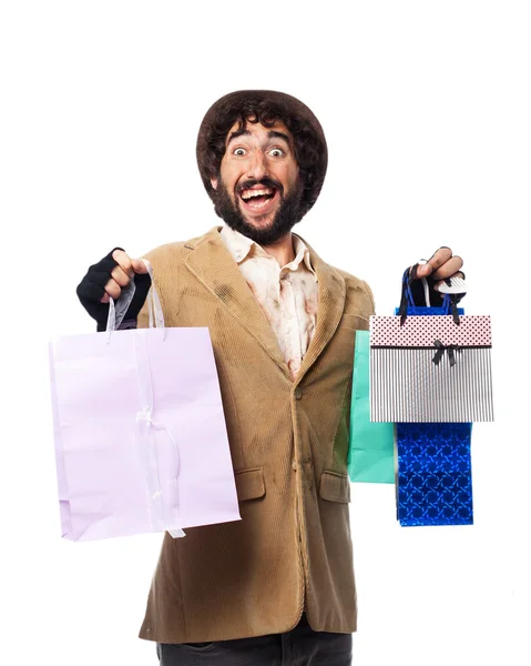 Homem sem-teto feliz com sacos de compras — Fotografia de Stock