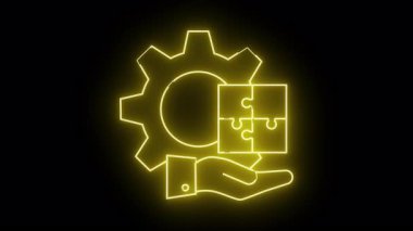 Sarı neon bir vites bulmacası parçası ve siyah bir arkaplanda bir el çiziyor.