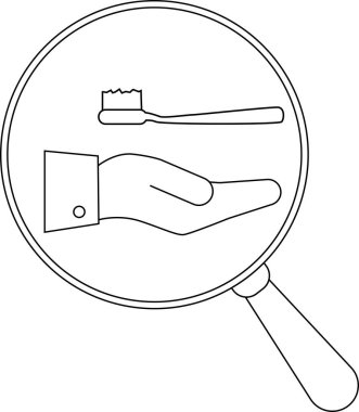 Büyütecin altında diş fırçasını tutan el.