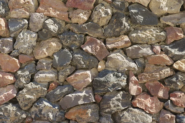 Alte Steinmauer Textur. Akrotiri, Santorini, Griechenland. — Stockfoto
