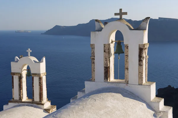 Church bell towers in Oia, Santorini, Greece. — Stock Photo, Image