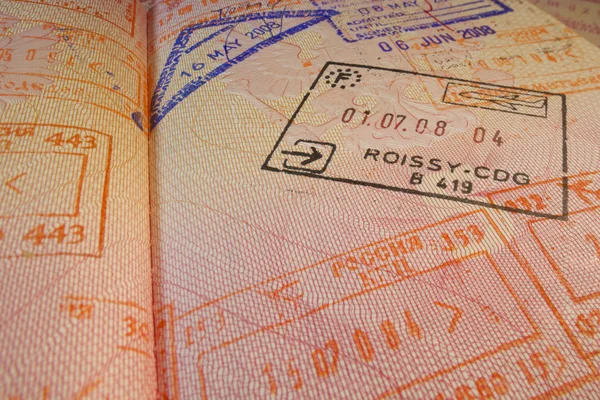 Passport page with Roissy-CDG French immigration control stamp. — Stock Photo, Image