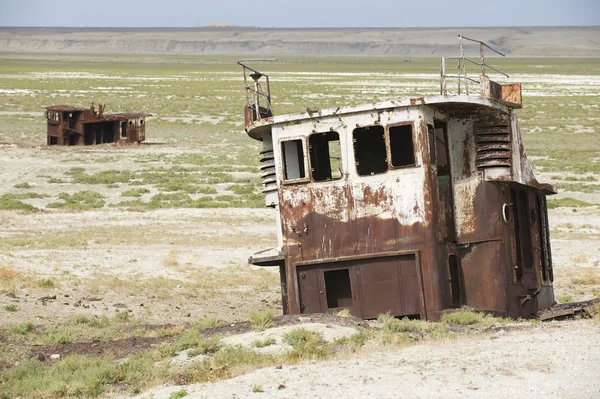 Rusted remains of fishing boat at the sea bed of the Aral sea, Aralsk, Kazakhstan.