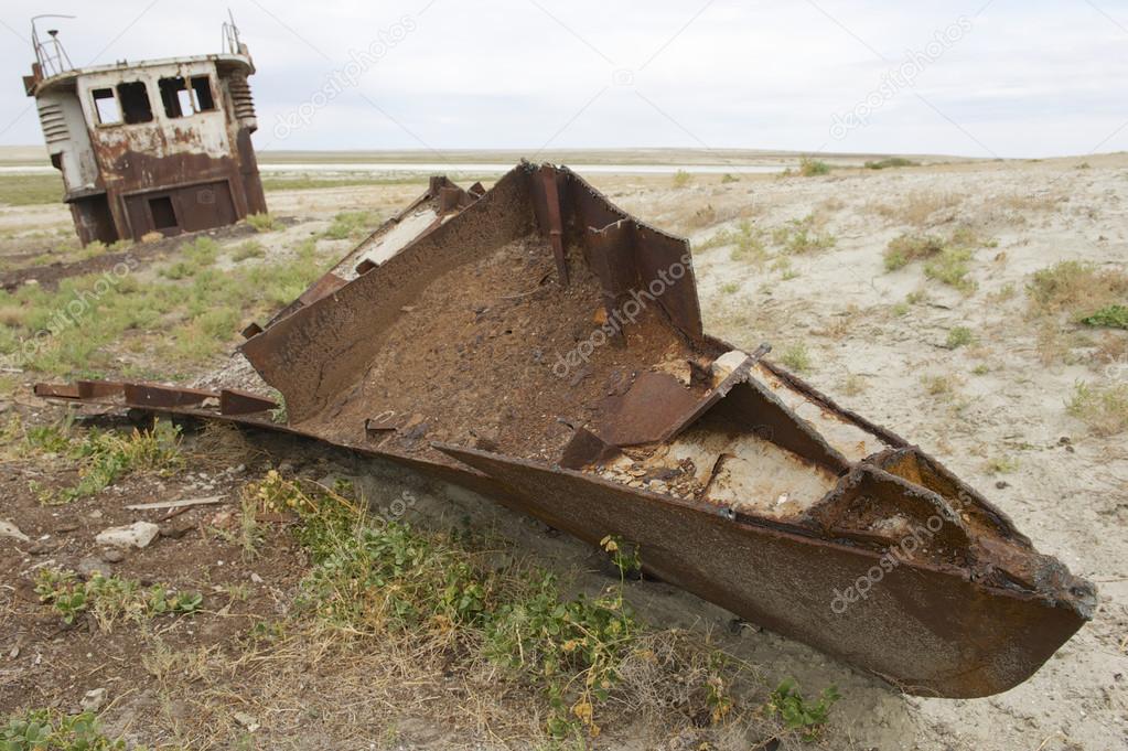 Rusted remains of fishing boat at the sea bed of the Aral sea, Aralsk, Kazakhstan.