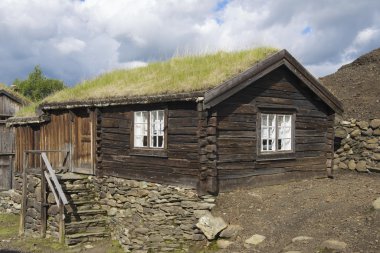 Exterior of the traditional timber house of the copper mines town of Roros, Norway. clipart