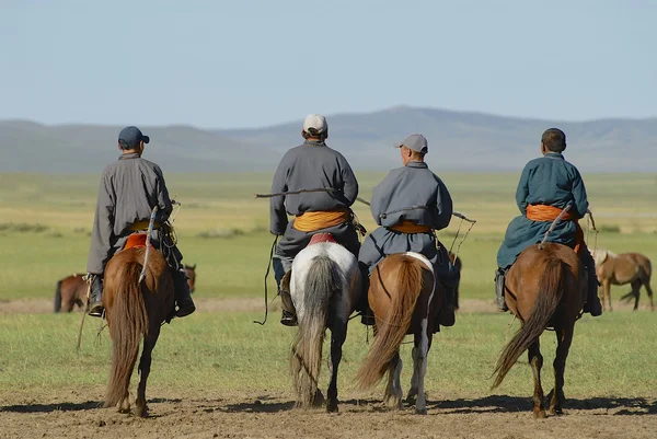Men ride on horseback circa Harhorin, Mongolia. — Stock Photo, Image
