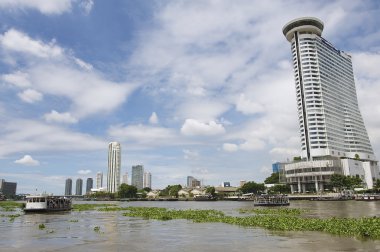 View to the Bangkok city buildings from the Chao Phraya River in Bangkok, Thailand. clipart