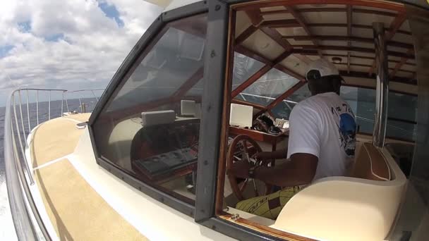 Man rides fishing boat in the Indian ocean circa Flic en Flac, Maurice . — Video