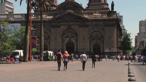 People walk by Plaza de Armas in Santiago, Chile. — Stock Video