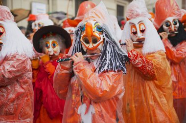 Women play flutes at Basel Carnival in Basel, Switzerland.
