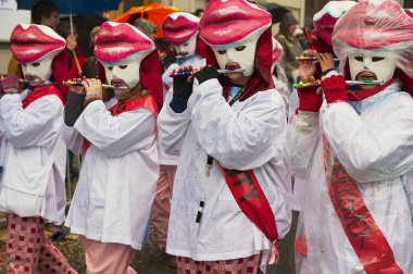 Women play flutes at Basel Carnival in Basel, Switzerland.