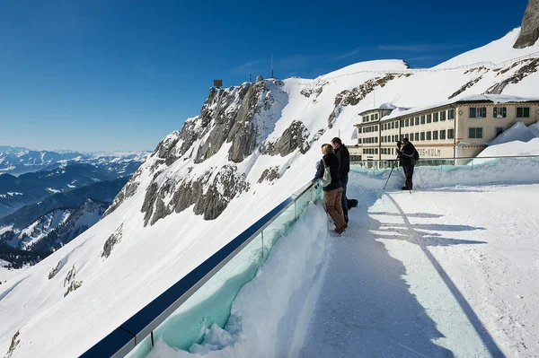 People enjoy the mountain view from the terrace on top of the Pilatus mountain in Lucern, Switzerland.