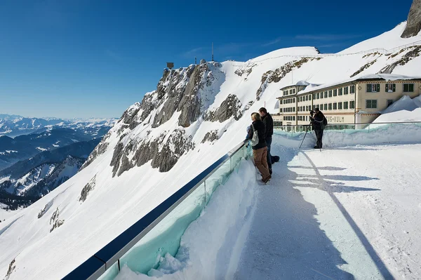 People enjoy the mountain view from the terrace on top of the Pilatus mountain in Lucern, Switzerland. — Stok fotoğraf