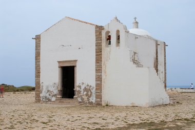 People visit church of Our Lady of Grace at Sagres point in Sagres, Portugal.