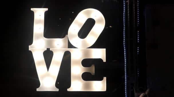 Word LOVE decorate Led light in the street at the night. — Stock Video