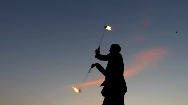 Fire Show at Sunset. Man Used Poi to Making Beautiful Effects. Slow Motion. — Stock Video