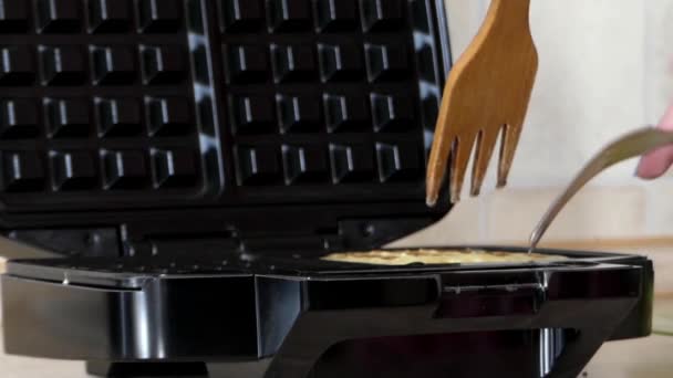 Girl Preparing Belgian Waffles in a Special Waffle Iron. — Stock Video