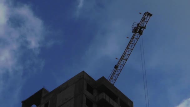 The building of the house. Crane on the sky background. — Stockvideo