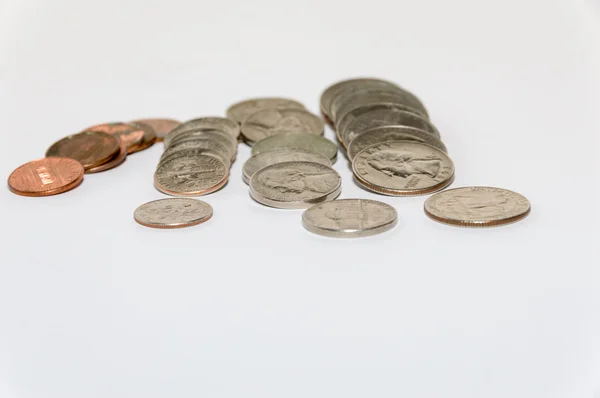 Rows of coins knocked over Stock Photo