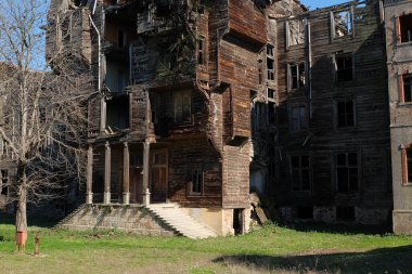 Abandoned building. Old house. Old wooden mansion from Princes Islands in Istanbul. Shabby decks on building. Sadness. Old age clipart