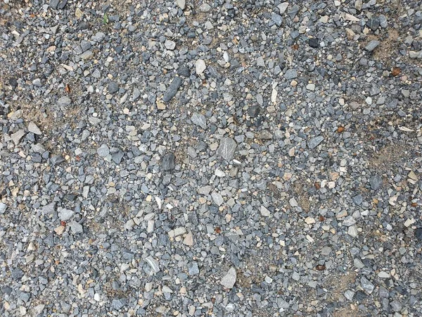 道路纹理背景上的鹅卵石 — 图库照片