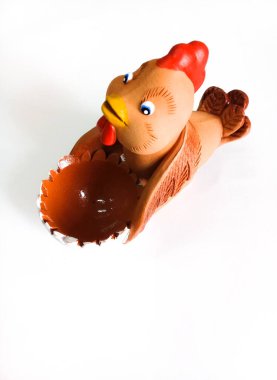 Easter egg holder made of clay in the shape of a chicken