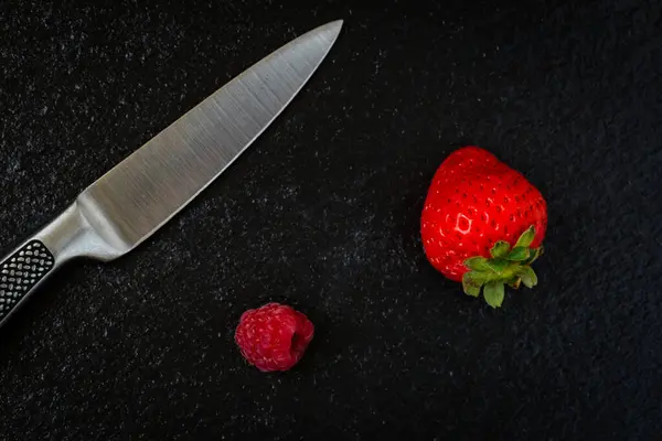 Strawberry Raspberry Next Kitchen Knife Placed Embossed Black Stone Background — Stock Photo, Image