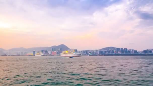 View from Star Ferry through Victoria Harbour timelapse hyperlapse, with the skyline of Hong Kong as backdrop — Stock Video