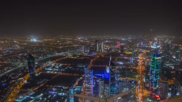 Skyline with Skyscrapers night timelapse in Kuwait City downtown illuminated at dusk. Kuwait City, Middle East — Stock Video