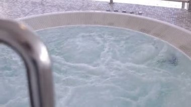 Whirlpool jacuzzi with pool. View from above.