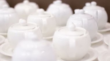 White teapots on a table