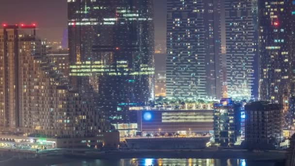 Buildings on Al Reem island in Abu Dhabi night timelapse from above. — Stock Video