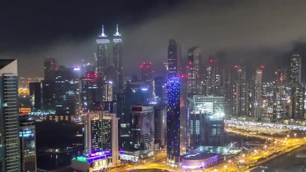 Aerial view of a big modern city at night timelapse. Business bay, Dubai, United Arab Emirates. — Stock Video