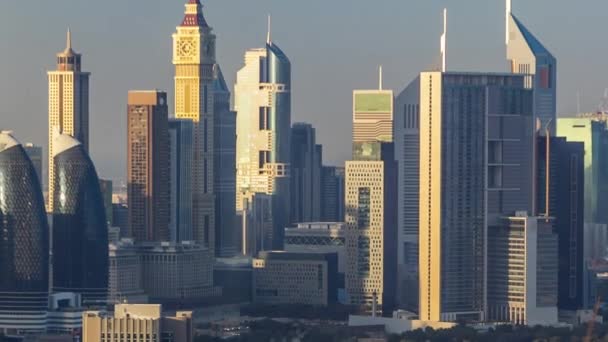 Dubai downtown skyline timelapse at sunset time. Rooftop view of Sheikh Zayed road with numerous towers. — Stock Video