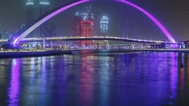 Pedestrian Bridge over the Dubai Water Canal night timelapse, United Arab Emirates — Stock Video