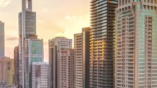 Downtown Dubai towers in the evening timelapse. Aerial view of Sheikh Zayed road with skyscrapers at sunset. — Stock Video