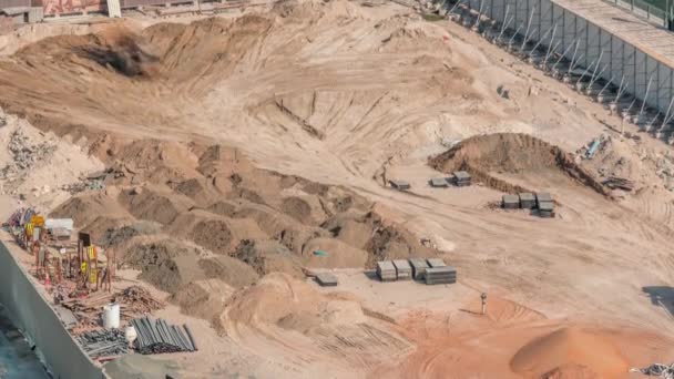 Wheel loader machine unloading sand at eathmoving works in construction site timelapse — Stock Video