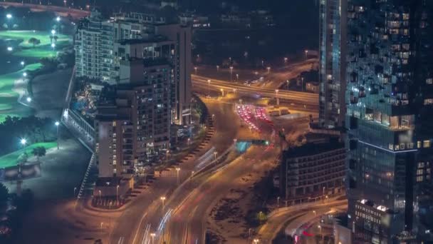 Big crossroad junction between JLT district and Dubai Marina intersected by Sheikh Zayed Road aerial night timelapse. — Stock Video