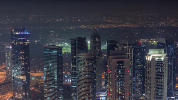 JLT skyskrapor nära Sheikh Zayed Road antenn natt timelapse. Bostadsbyggnader — Stockvideo