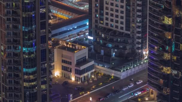 Aerial view of a road intersection between skyscrapers in a big city timelapse. — Stock Video