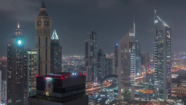 Skyscrapers on Sheikh Zayed Road and DIFC night timelapse in Dubai, UAE. — Stock Video